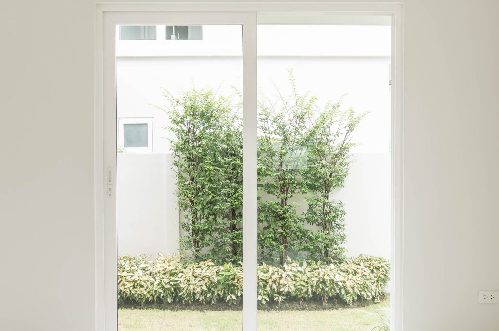 empty glass door in living room interior background